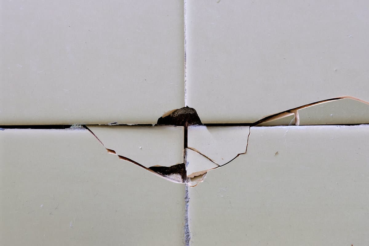  cracked tile bathroom wall unknown possible reasons 